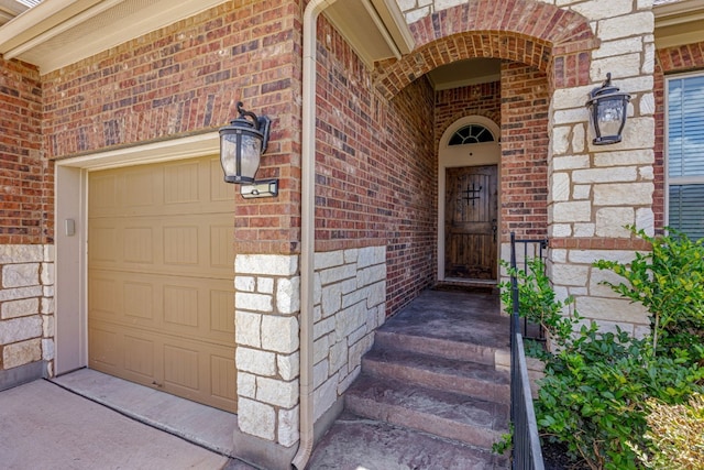 view of exterior entry featuring a garage