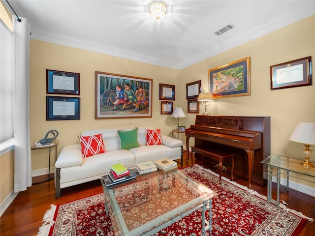 living room with wood-type flooring and crown molding