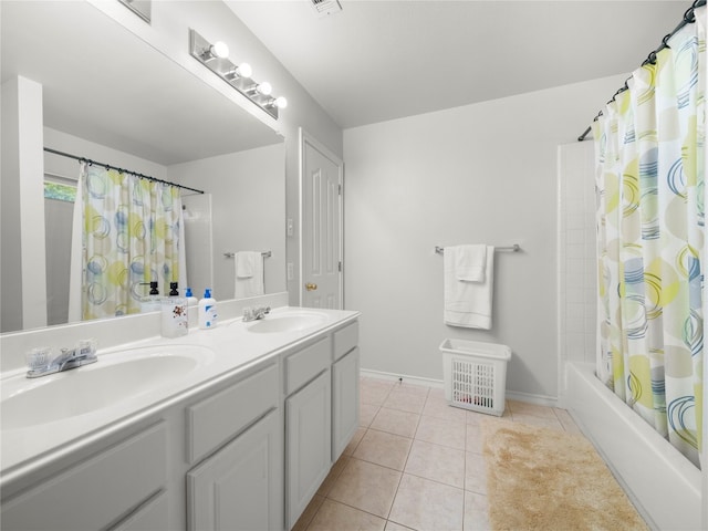 bathroom featuring tile patterned floors, vanity, and shower / bathtub combination with curtain