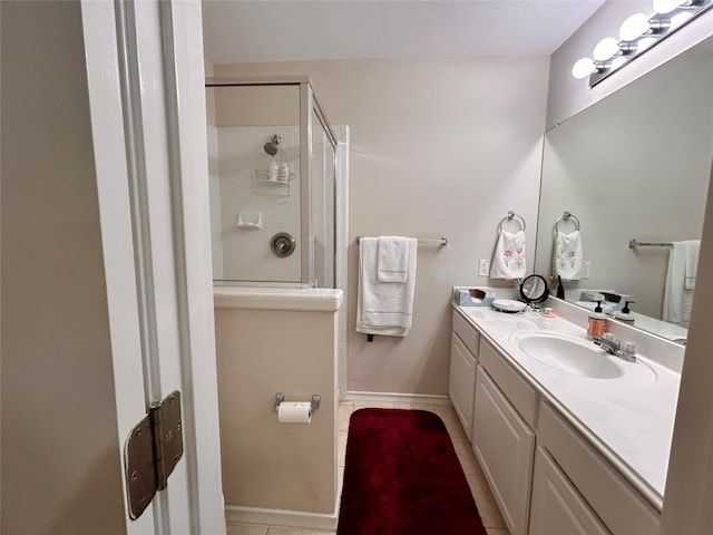 bathroom with tile patterned flooring, vanity, and a shower with shower door