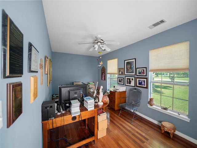 home office with hardwood / wood-style flooring and ceiling fan