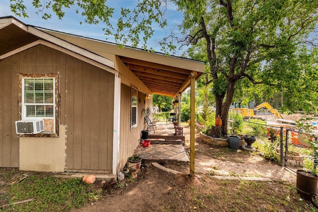 view of side of home featuring cooling unit