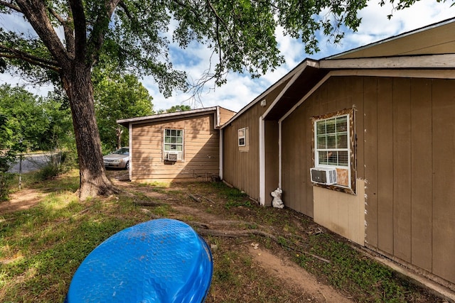 view of home's exterior featuring cooling unit