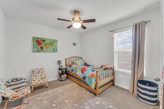 bedroom featuring light carpet and ceiling fan