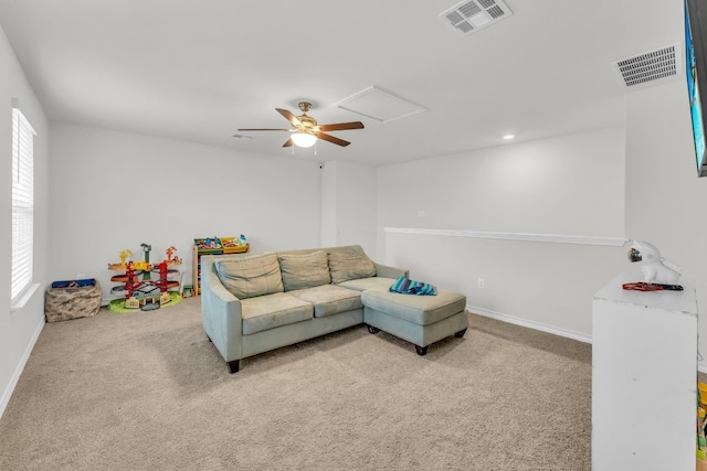 living room with light carpet and plenty of natural light