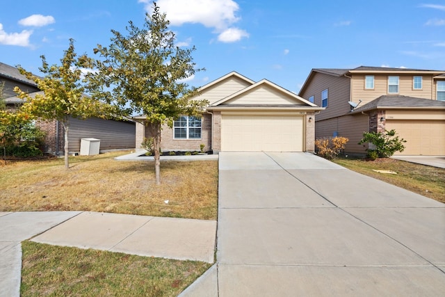 view of front of property with a garage and a front lawn