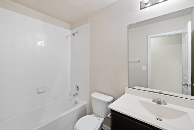 full bathroom with vanity, toilet, and tiled shower / bath