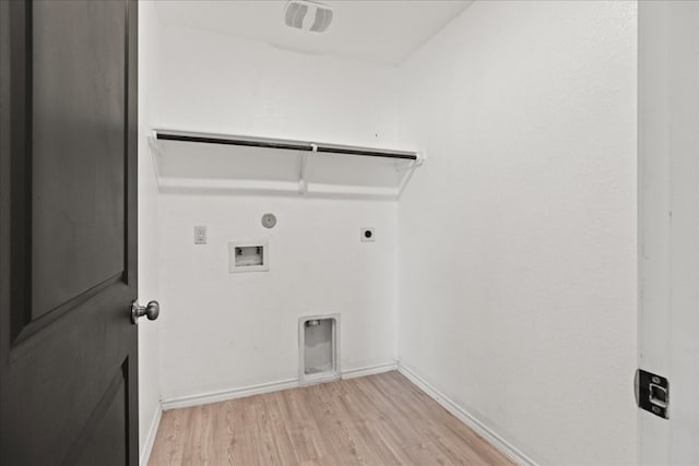 laundry room with gas dryer hookup, light hardwood / wood-style flooring, washer hookup, and hookup for an electric dryer