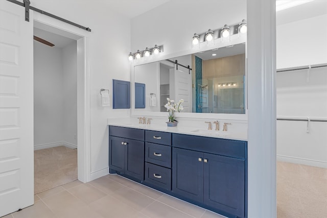 bathroom featuring tile patterned flooring, vanity, and an enclosed shower