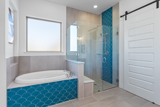 bathroom with tile patterned floors and separate shower and tub