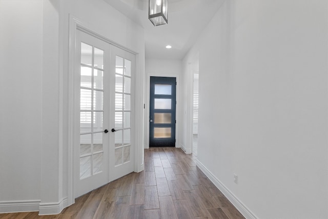 doorway to outside with hardwood / wood-style flooring and french doors