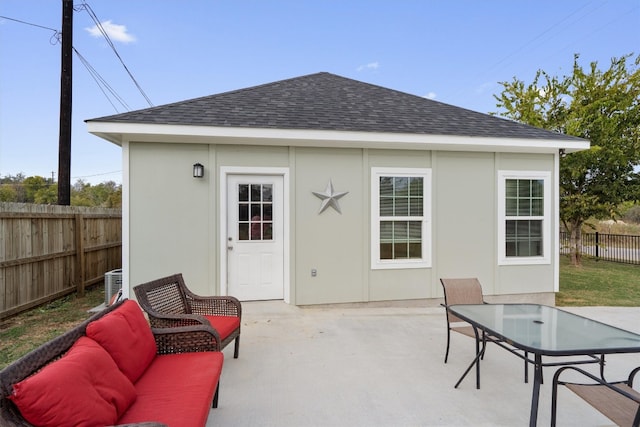 exterior space with central AC unit and an outdoor structure