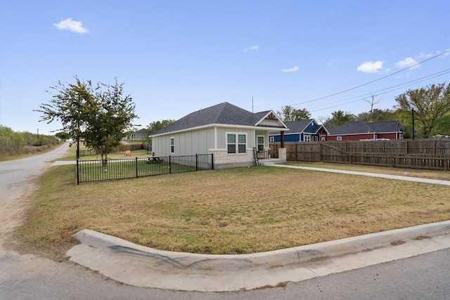 226 Spruce Ave, Luling, TX 78648 - view of front facade with board and batten siding and a shingled roof