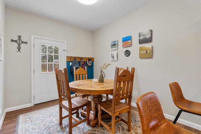 226 Spruce Ave, Luling, TX 78648 - dining space with baseboards and wood finished floors