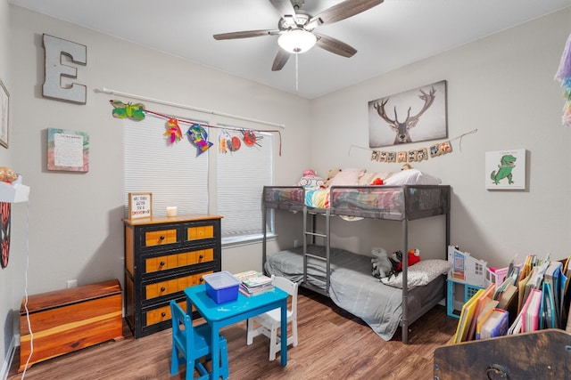 bedroom with ceiling fan and hardwood / wood-style floors