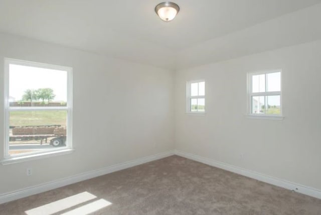 empty room with carpet flooring