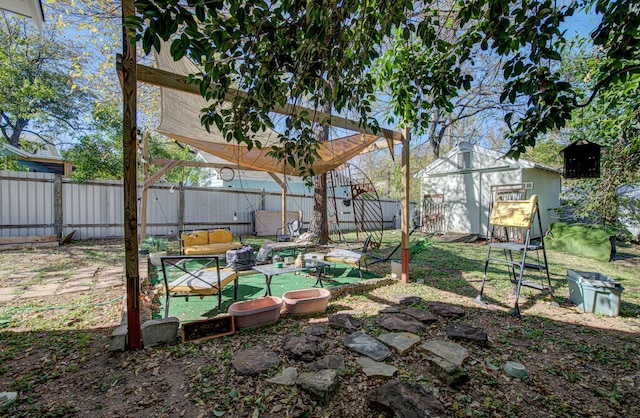 view of yard with a shed and an outdoor hangout area