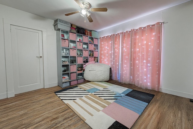 bedroom featuring ceiling fan and hardwood / wood-style floors