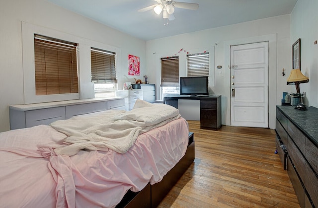 bedroom with ceiling fan and light wood-type flooring