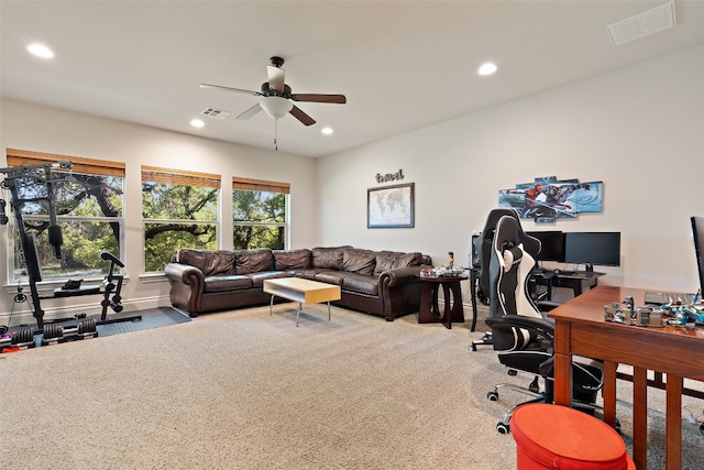 carpeted home office featuring ceiling fan, visible vents, and recessed lighting