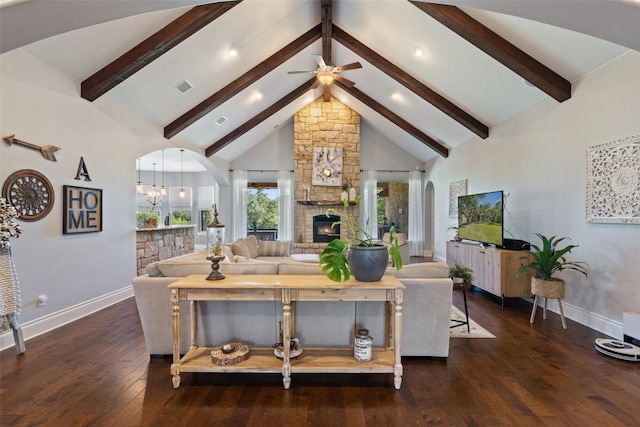 living area with high vaulted ceiling, hardwood / wood-style flooring, a fireplace, visible vents, and beamed ceiling