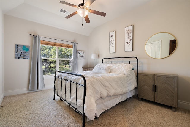 bedroom with light carpet, baseboards, visible vents, and vaulted ceiling