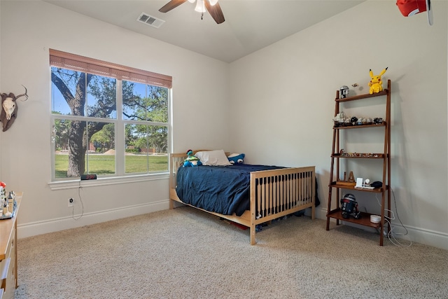 carpeted bedroom with ceiling fan, visible vents, and baseboards