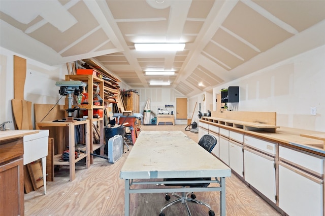 interior space with light wood-style floors and a workshop area