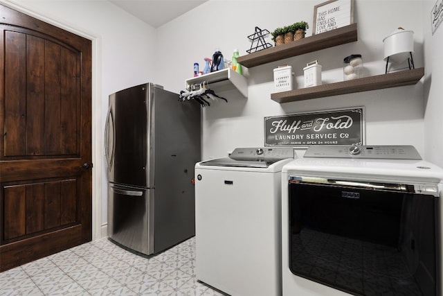 laundry room with laundry area and washer and clothes dryer