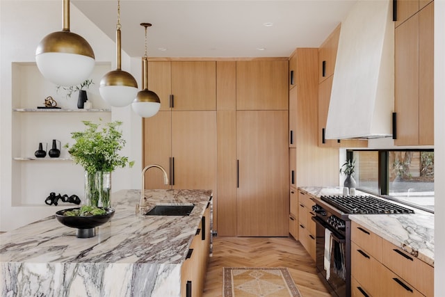 kitchen featuring pendant lighting, light brown cabinetry, high end stainless steel range, and light stone counters