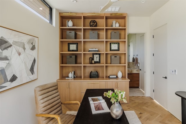 home office with light parquet flooring