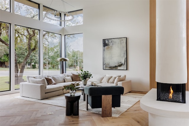 interior space featuring a notable chandelier and a multi sided fireplace