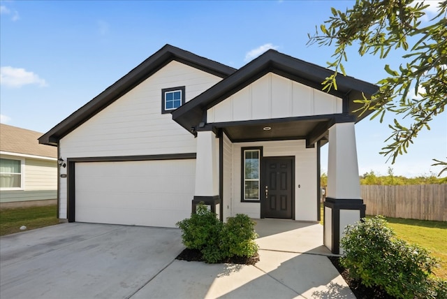 view of front of property featuring covered porch and a garage