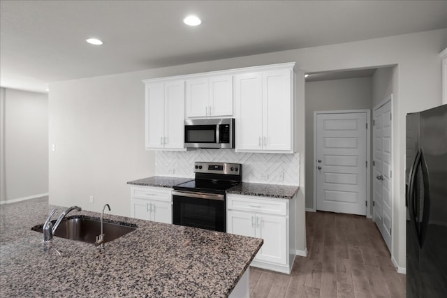 kitchen with white cabinetry, sink, and stainless steel appliances