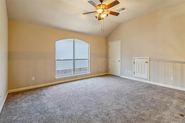 carpeted empty room featuring ceiling fan and vaulted ceiling