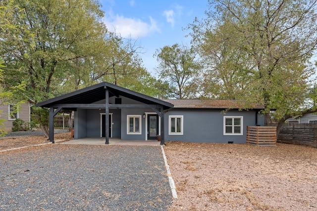 single story home featuring a carport