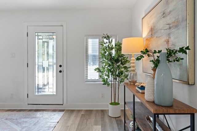 doorway to outside with hardwood / wood-style flooring