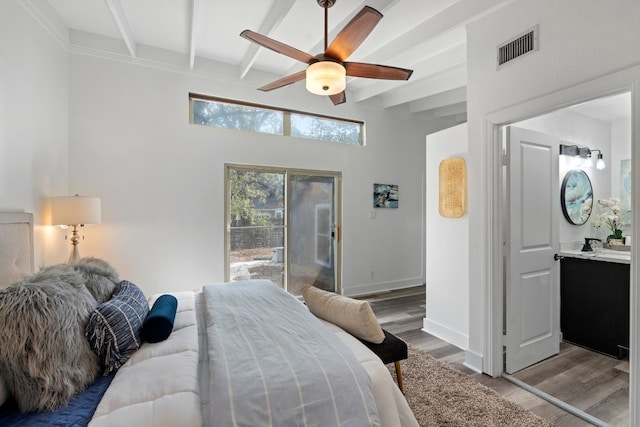 bedroom with hardwood / wood-style flooring, ceiling fan, beam ceiling, and access to outside