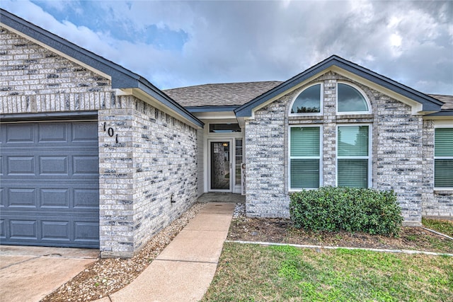 property entrance with a garage