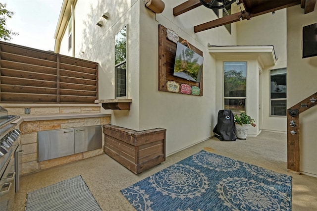 view of patio / terrace featuring ceiling fan