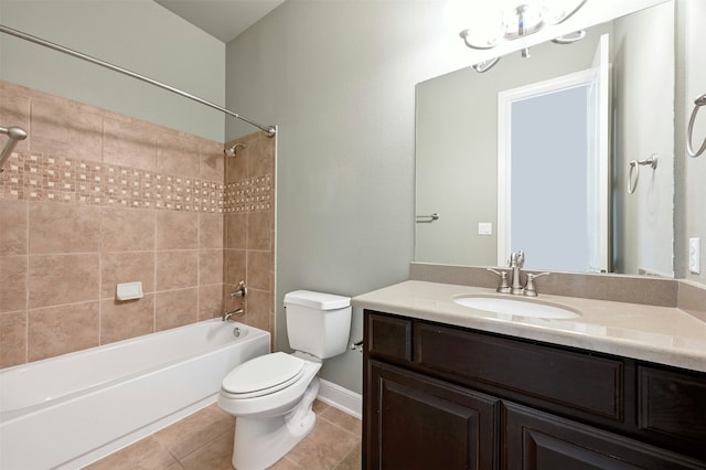 full bathroom with tiled shower / bath, tile patterned floors, toilet, and vanity