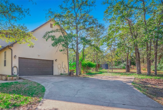 view of side of property featuring a garage