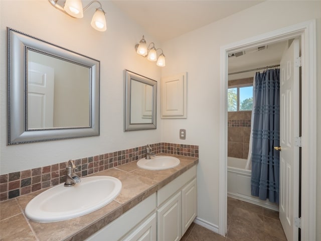 bathroom featuring vanity, shower / bath combo, and backsplash