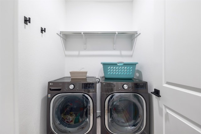 washroom featuring washing machine and dryer