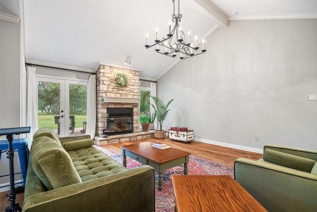 living room featuring french doors, vaulted ceiling with beams, a notable chandelier, hardwood / wood-style floors, and a fireplace