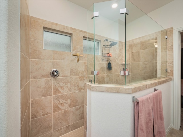 bathroom featuring tiled shower