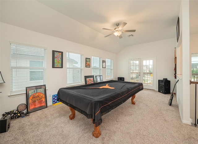 rec room featuring a wealth of natural light, ceiling fan, light carpet, and vaulted ceiling