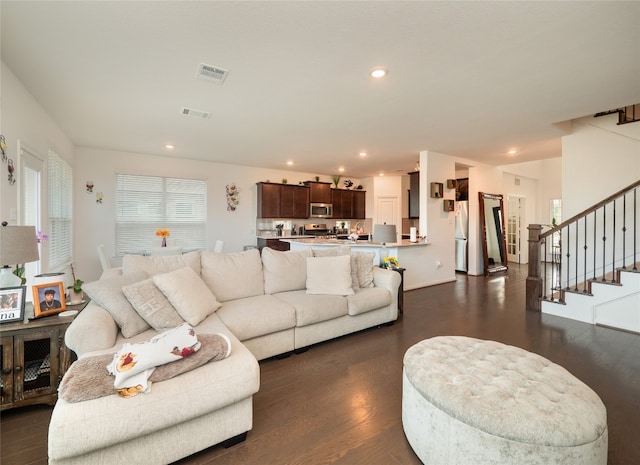 living room featuring dark wood-type flooring