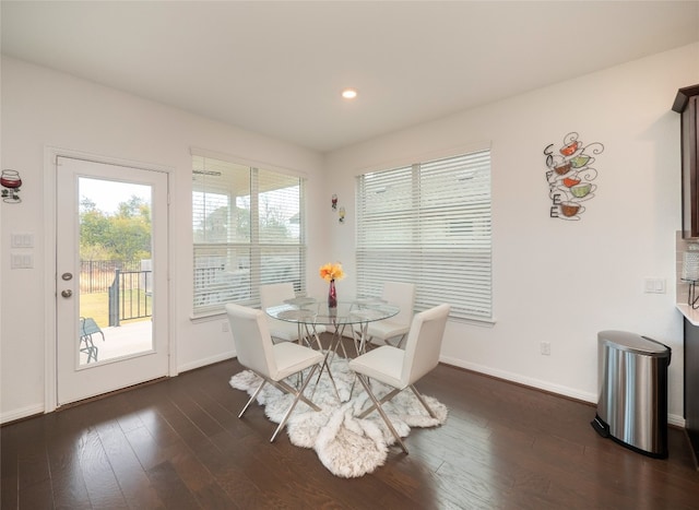 dining area with dark wood-type flooring