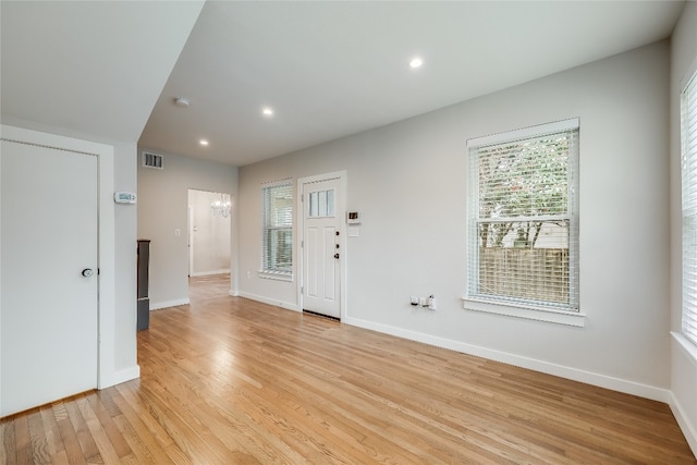 foyer entrance with light hardwood / wood-style floors